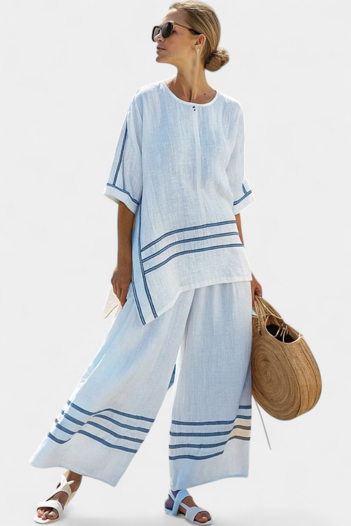 Complete with wide striped pants with an irregular cut - modern and comfortable style