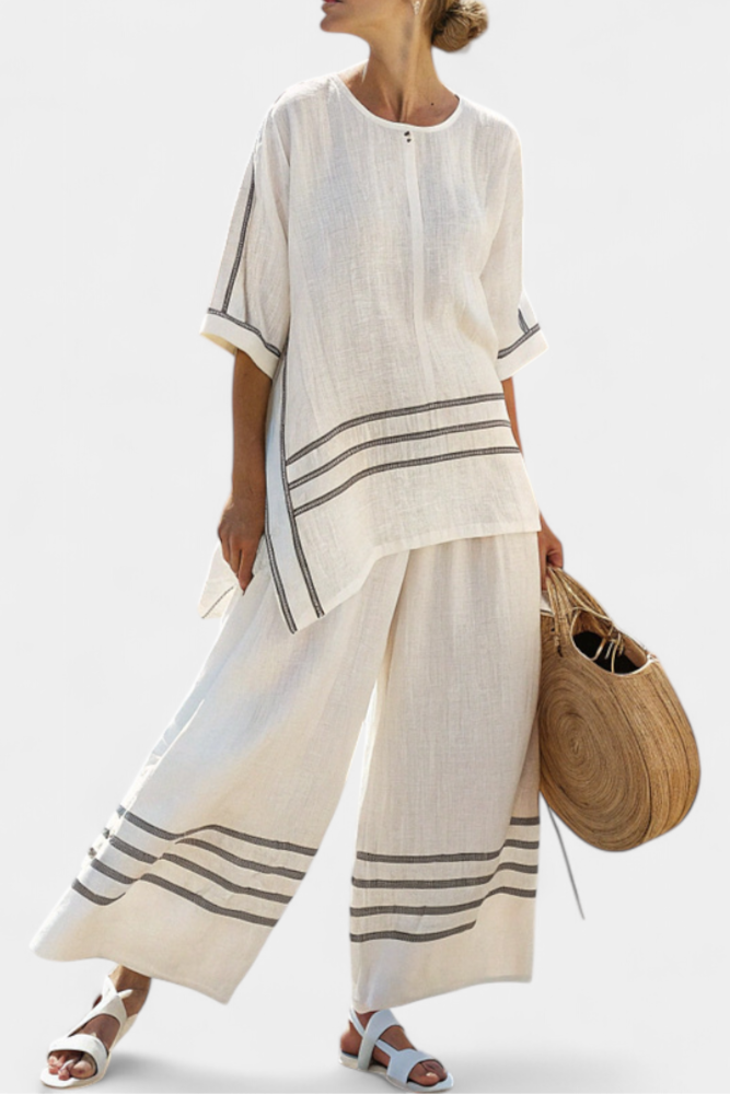 Complete with wide striped pants with an irregular cut - modern and comfortable style