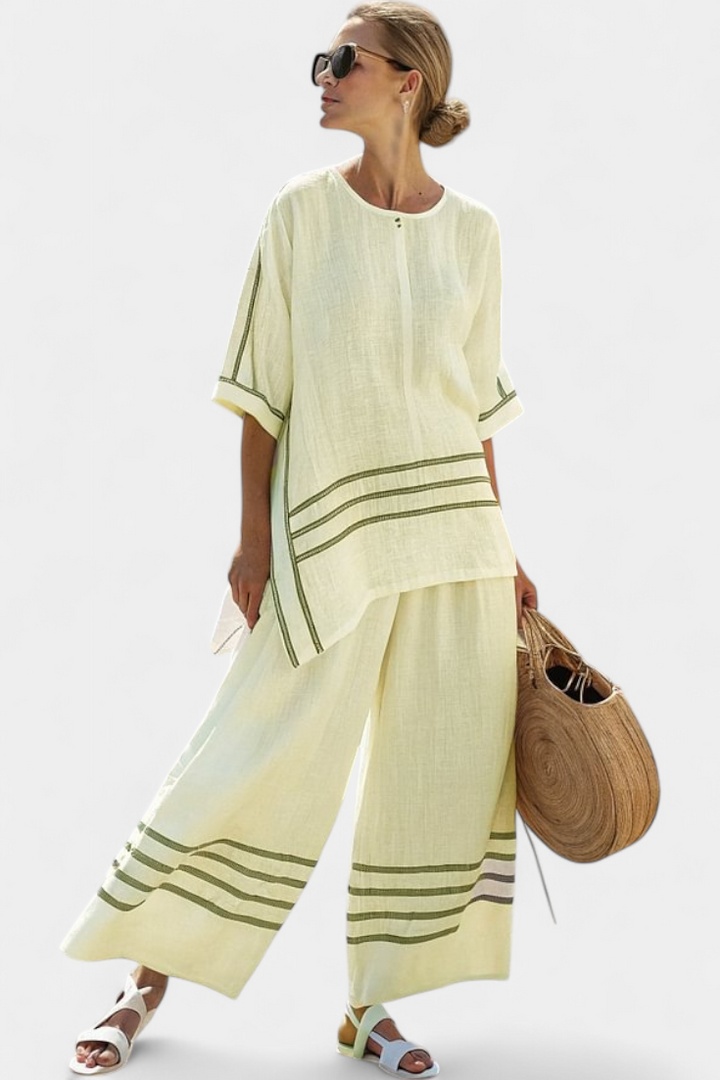 Complete with wide striped pants with an irregular cut - modern and comfortable style