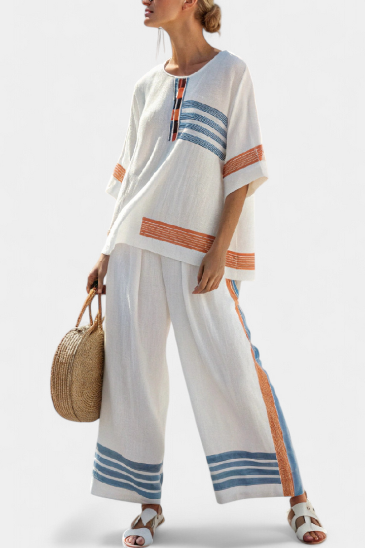 Complete ethnic Daisy in white with blue and orange striped details – unique and vibrant style